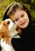adorable girl hugging cavalier